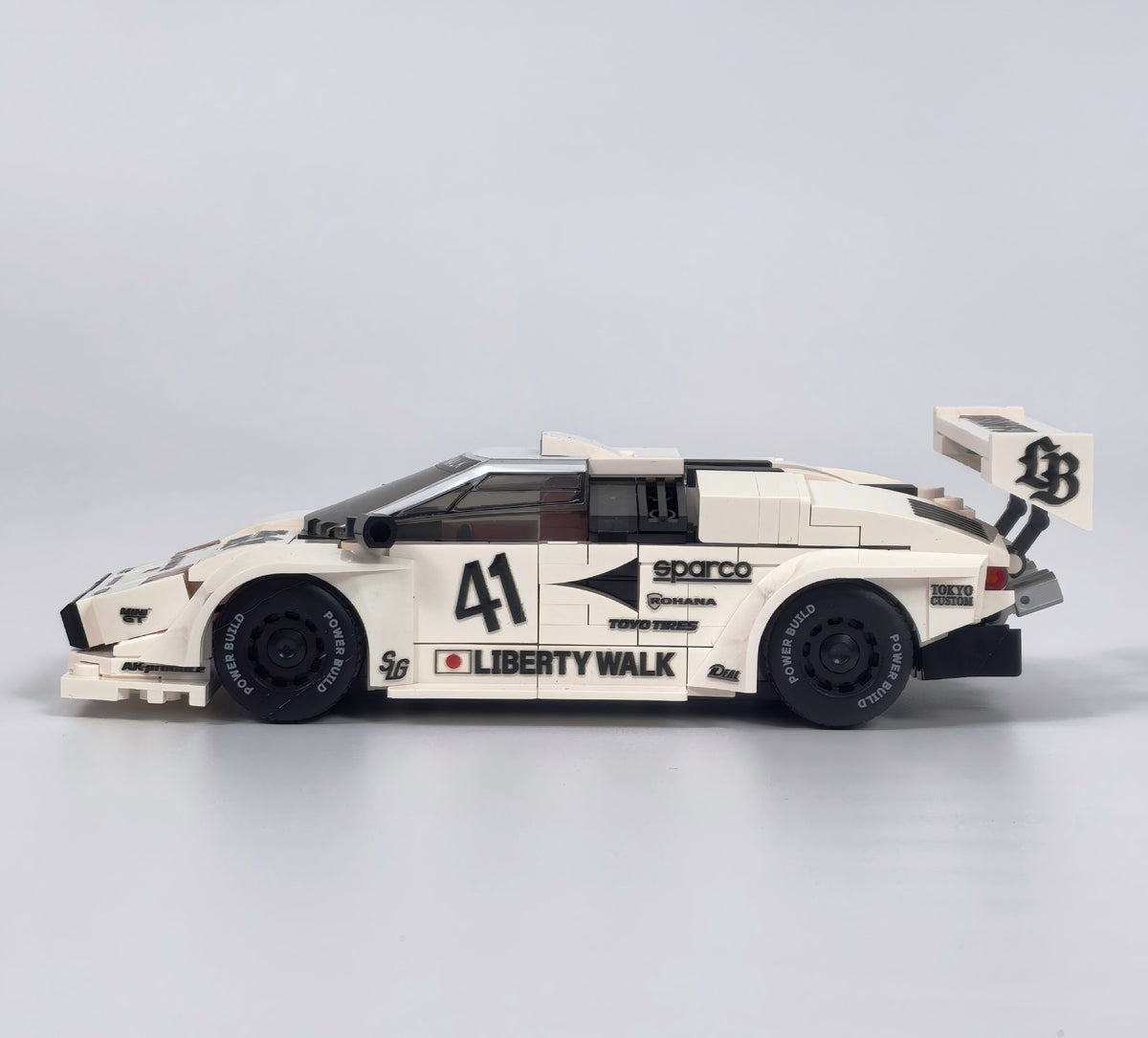 Trilumity Motorized Building Block Set: 80s Wedge Supercar Widebody Edition | Container Display Case (338-Piece)