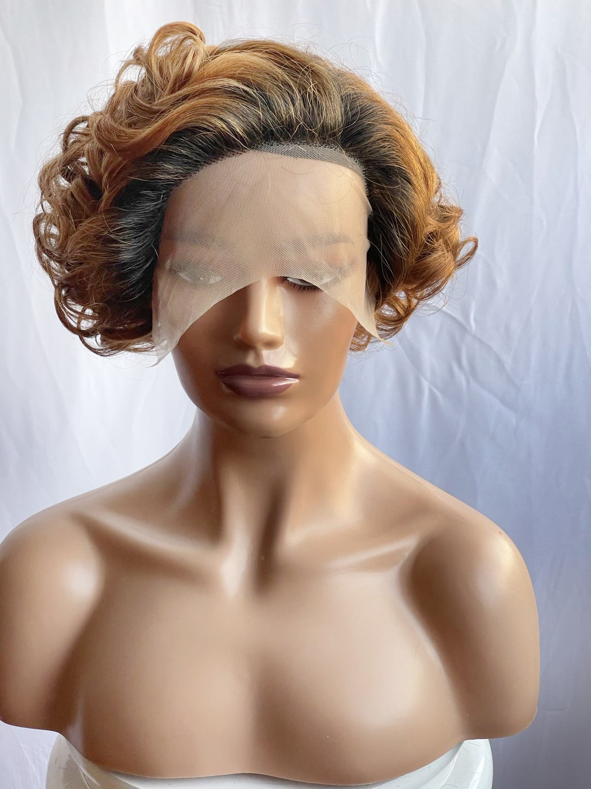 Trilumity Curly Lace Front Wig in Honey Blonde, hairline close-up